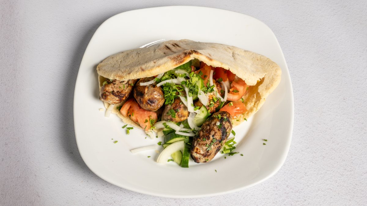 Sheftalies in pita with salad